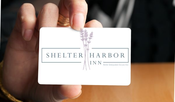 Gift Card | Person holding a Shelter Harbor Inn Gift Card